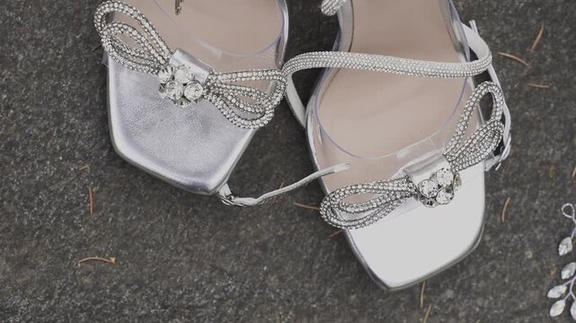 Beautiful white bride's shoes on the stone