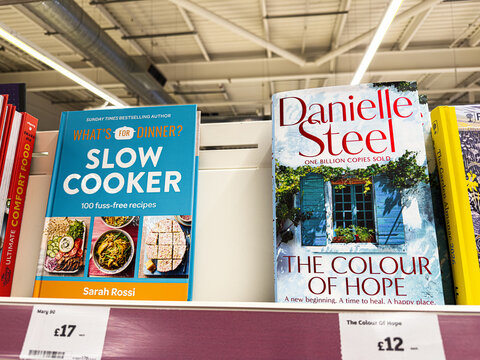 Two bestselling cookbooks on a shelf: Slow Cooker and The Colour of Hope by Danielle Steel