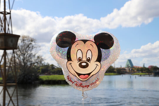 Mickey Mouse balloon with his face and ears on an outdoor background