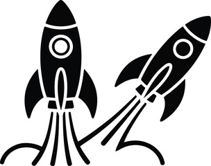 Fototapeta premium Two black silhouette rockets launching upwards and at an angle signifying progress and ambition