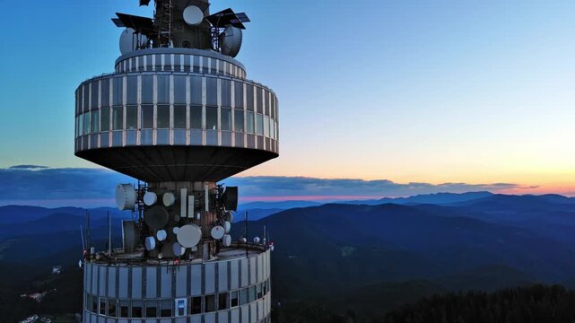 Tower Snezhana on peak of Snezhana covered with spruce forests in Rhodope mountains