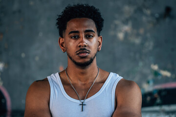 Obraz premium portrait of a young latino man on the street