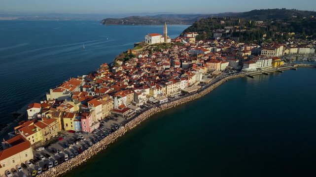 Piran Slovenia Aerial Showcase: Coastline Flight from Cape Madona Lighthouse to Old Port, Historic Peninsula Town View Venetian Architecture & Adriatic Sea Cinematic Mediterranean Aesthetics Drone 4k 