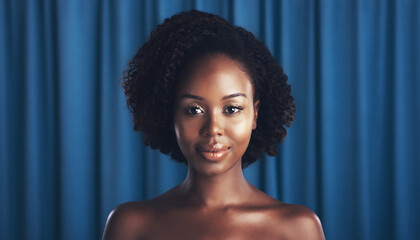 black woman with a blue drape background