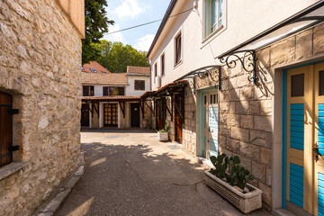 Trebinje old town alley with traditional stone architecture, Bosnia and Herzegovina.