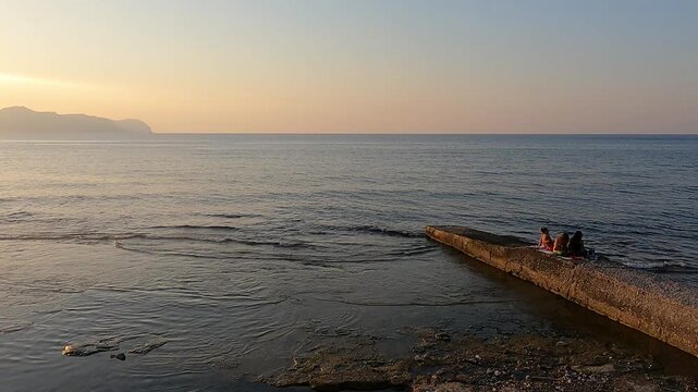 Sunset at the beach in Aspra, Sicily. Italy