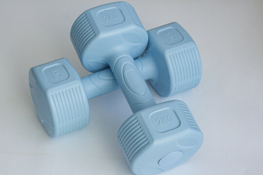 A pair of 2-kilogram dumbbells for home workouts and bodybuilding.