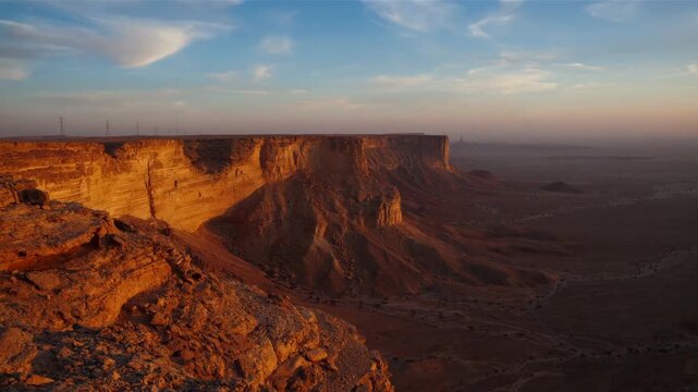 Saudi Founding Day at the Edge of the World cliffs during a golden sunset
