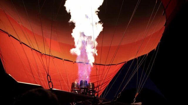 Flame of fire inflating a hot air balloon in the early morning, 4K, Sony Images