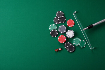 Casino dice and chips on a colored background, poker, gambling with bets. Dice and chips