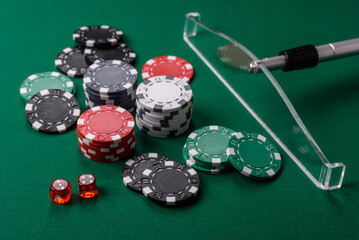 Casino dice and chips on a colored background, poker, gambling with bets. Dice and chips