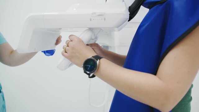 Healthcare Workers Collaboratively Set Up Diagnostic Imaging Devices Within Sterile Clinical Setting