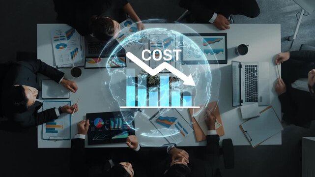 A diverse group of professionals engages in a strategic financial meeting, analyzing data to discuss cost reduction strategies and enhancing business performance. Raster