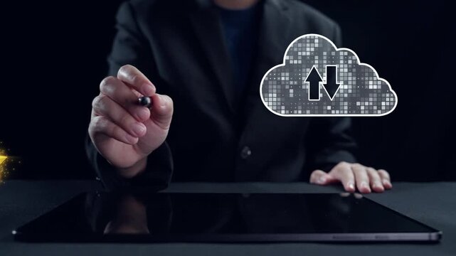 A business professional interacts with digital cloud symbols representing data transfer in a sleek office environment. This image showcases modern technology and innovation. Qubit