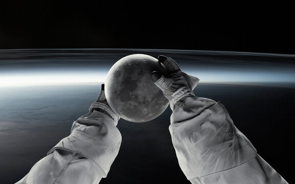 Astronaut holding the Moon in space, a powerful visual symbolizing humanity's return and the upcoming Artemis 2 mission