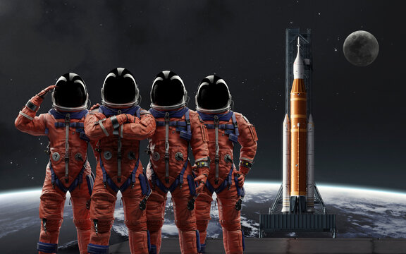 The four-person crew of the Artemis II mission salutes in their orange OCSS suits, ready for their historic journey in orbit between Earth and the Moon
