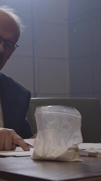 Criminal Trial lawyer in court pointing to notes - modern court room scene