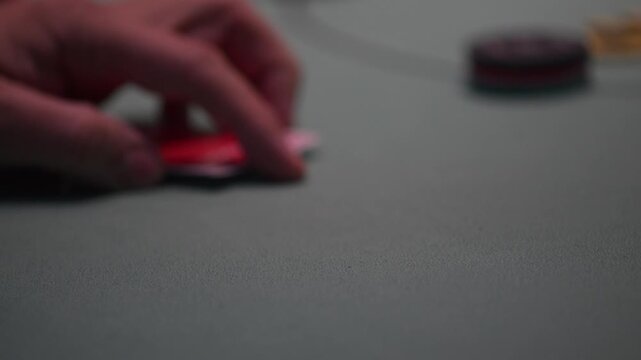 Close up view of two cards during a Texas hold 'Em poker game with defocused background