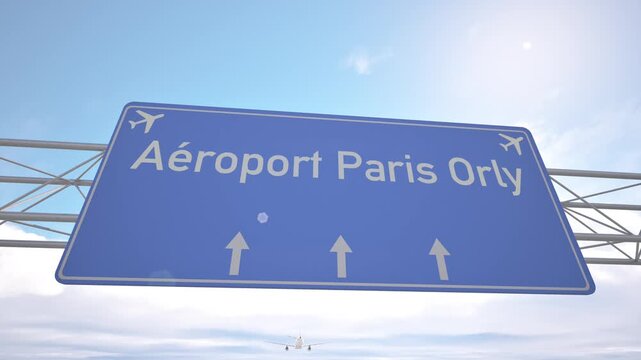 Highway direction sign for Paris Orly Airport with passenger jet lowering toward the airport, arriving to Paris, France.