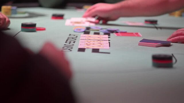 Close up view of two cards during a Texas hold 'Em poker game with defocused background