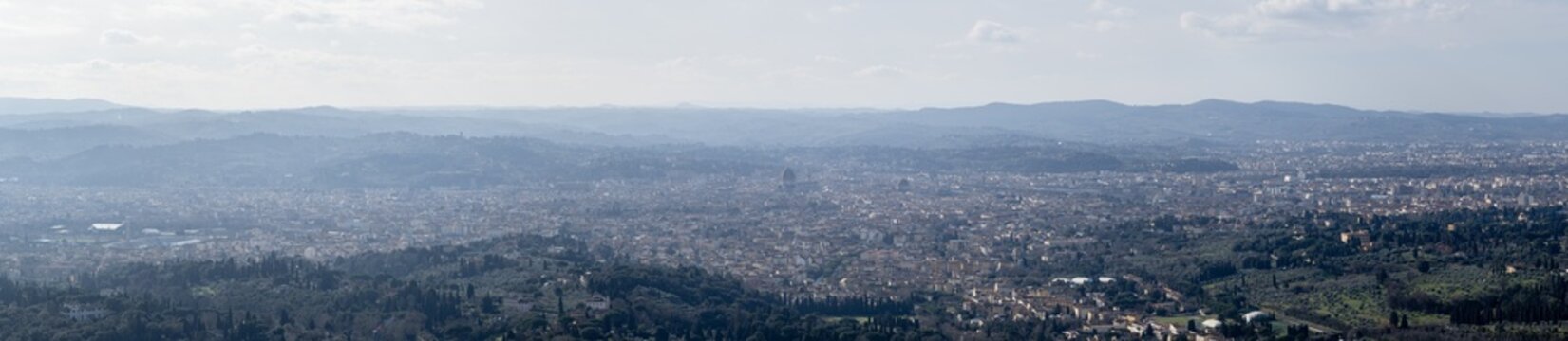 Tuscan Hilltop Cityscape View. Fiesole Overlooking Florence With Historic Rooftops. Sunlit Skyline Of Florence From Fiesole Over Hills
