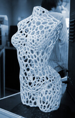 Art model female body printed on 3D printer from molten plastic. Object created on 3D printer. Form printed on 3D printer from blue plastic. Concept 3D printing technology. Additive FDM technologies