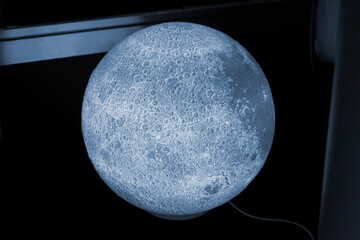 Art model lamp Moon printed on 3D printer from molten plastic. Object created on 3D printer. Form printed on 3D printer from blue plastic. Concept 3D printing technology. Additive FDM technologies