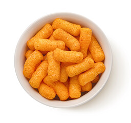 Crispy corn sticks isolated on white background, top view, full depth of field