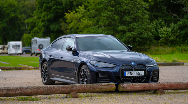 Fj&auml;r&aring;s, Sweden - August 25 2024: Dark blue 2023 BMW i4 M50 on a parking lot.