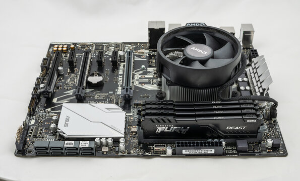 Gothenburg, Sweden - december 13 2024: Asus Prime X370 Pro AM4 ATX PC motherboard with AMD cooler and four memory modules.
