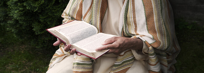 Old man reading the book