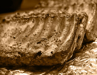 Fried ribs lie on foil