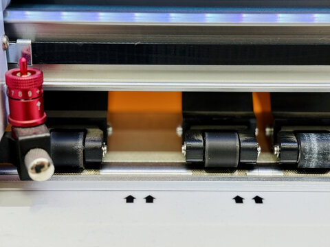 Laminator With Sensors. Metal Rail Coating Machinery Operated. Protective Film Application On Metal Components. Industrial Laminating Device With Quality Control Indicators