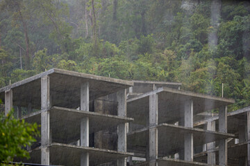 Obraz premium view from balcony from luxury villa to palm trees on the beach in heavy rain, nobody