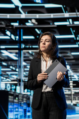 Cloud computing, infrastructure rigs inspection and manager walking through server hub rows....