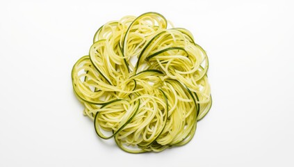 Isolated raw zucchini noodles. Top-down view on white background