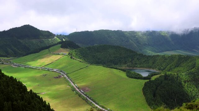 Landscape in Sete Cidades with the green meadow and lake Lagoa Rasa. Island of Sao Miguel, Azores, Portugal