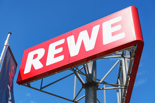 Big outdoor logo of REWE, German food retailer