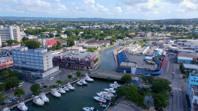 Yachts moored at Careenage (Constitution River) in historic city center of Bridgetown, Barbados. Historic Bridgetown and its Garrison is a UNESCO World Heritage Site.