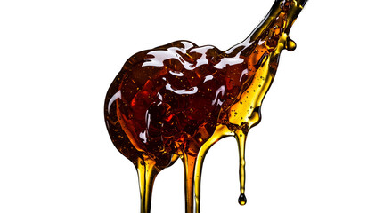 Viscous amber liquid dripping from a spoon on black background