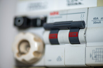 Macro photograph of an electric panel displaying numerical readings, switches, and circuits in sharp detail.