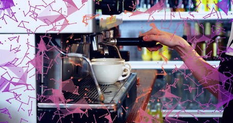 Pulling espresso, barista in dark sleeve gripping portafilter at cafe counter with espresso maker