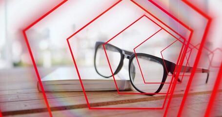Resting black glasses sitting on closed notebook at wooden slatted table, with red overlays
