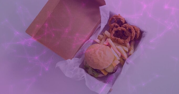 Purple-pink overlay pulsing, sweeping over open kraft box, highlighting burger, fries, onion rings