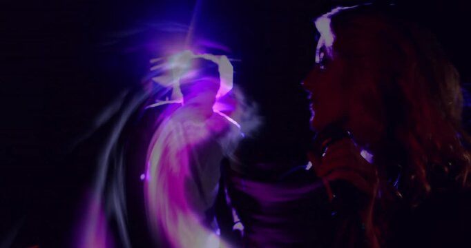 Woman singer singing into mic on music stage purple swirl forming and overlaying face boosting mood