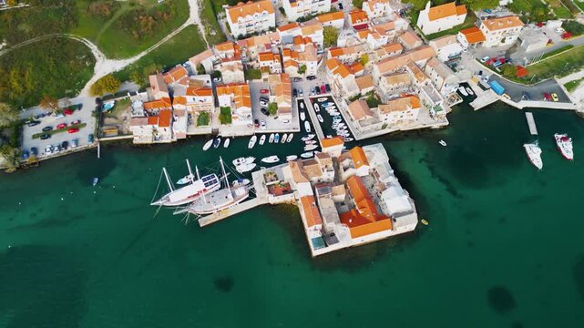 Ka&scaron;tilac Castle on the water Ka&scaron;tel Gomilica in Croatia, Split - 4K aerial drone view - tourist location filmed in Game of Thrones