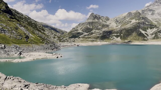 Panoramic view of turquoise water from Monte Spluga Lake dam - Italy