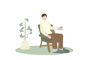 一人がけソファでコーヒーを飲む男性