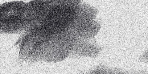 Abstract grayscale cloud-like formation with soft edges and a granular speckled texture, offering a nebulous background for creative and artistic projects