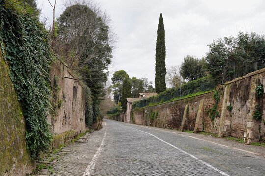 A contemporary view of the ancient Via Appia road within the city limits of Rome.